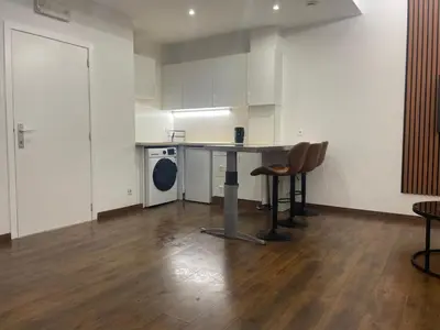 a kitchen with a table and chairs in a room at Boutique Diamond Apartments in Antwerp