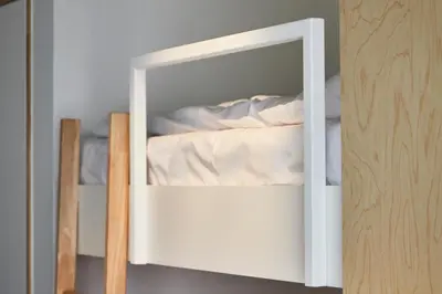 a white bunk bed with a mirror in a room at Het Kasterhuis in Wetteren