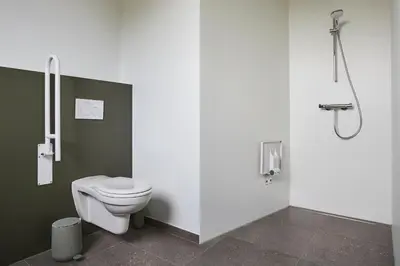a bathroom with a toilet and a shower at Het Kasterhuis in Wetteren