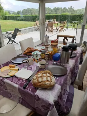 a table with a table cloth with food on it at Maison d'hôte in Grez-Doiceau
