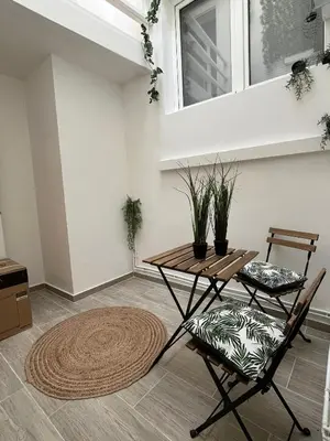 a living room with a table and two chairs at Studio n1 Bruxelles Centre Ville in Brussels