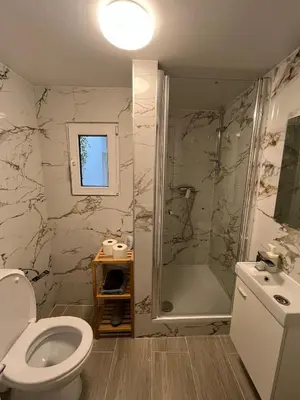 a bathroom with a shower and a toilet and a sink at Studio n1 Bruxelles Centre Ville in Brussels