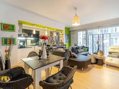 a living room with a couch and a table at Luxe Serene Residence in Brussels