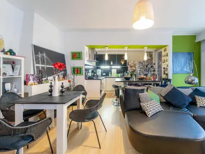 a living room with a couch and a table at Luxe Serene Residence in Brussels