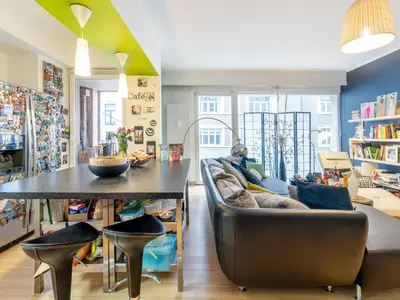 a living room with a couch and a table at Luxe Serene Residence in Brussels