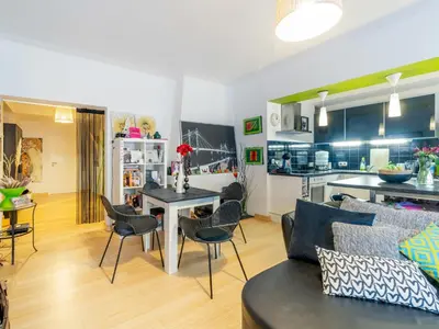 a living room with a couch and a table at Luxe Serene Residence in Brussels