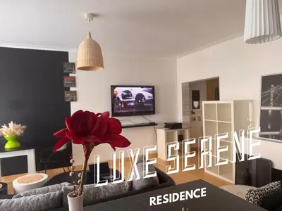 a living room with a red flower in a vase at Luxe Serene Residence in Brussels