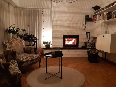 a living room with a couch and a fireplace at TML Vintage Villa 80 in Boom