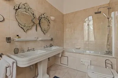 a bathroom with a sink and a tub and a toilet at Le Papillon Antwerp Suite 3 in Antwerp