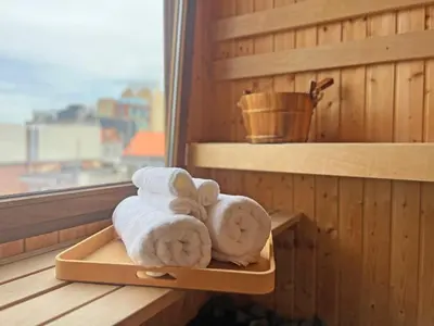 a tray of towels sitting in a sauna at Astrid Sauna Appartement Antwerp in Antwerp