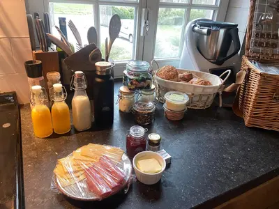 a kitchen counter with food and other items on it at Tipi Bo Deluxe in Kaprijke