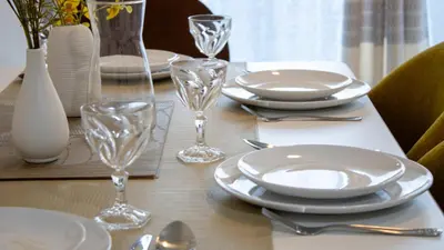a table with plates and glasses on a table at Atomium Brussels Expo Stay in Brussels
