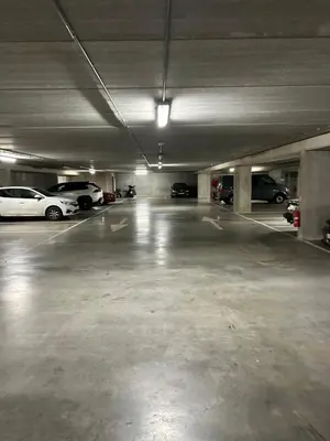 an empty parking garage with cars parked in it at Atomium Brussels Expo Stay in Brussels