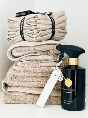 a pile of towels sitting next to a pile of towels at Luxurious Escape - Room LoveSerenity with pool and jacuzzi in Brussels