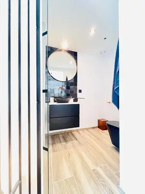 a bathroom with a sink and a mirror at Luxurious Escape - Room LoveSerenity with pool and jacuzzi in Brussels