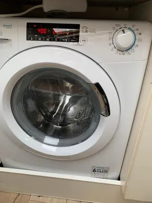 a washing machine with its door open in a room at Central Brussel - steps Grand Place - local vibrant neighbourhood in Brussels