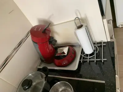 a kitchen with a red blender on a counter at Central Brussel - steps Grand Place - local vibrant neighbourhood in Brussels