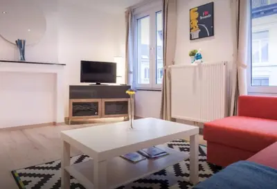a living room with a couch and a coffee table at Central Brussel - steps Grand Place - local vibrant neighbourhood in Brussels