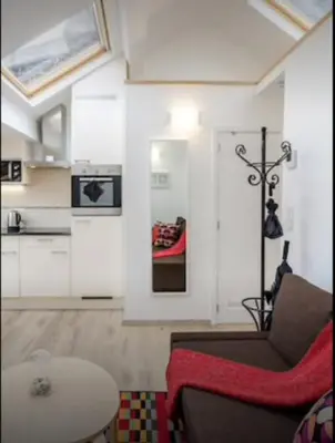 a living room with a couch and a table at Central Brussel - steps Grand Place - local vibrant neighbourhood in Brussels