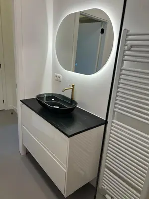 a bathroom with a black sink and a mirror at Studio 59 in Antwerp