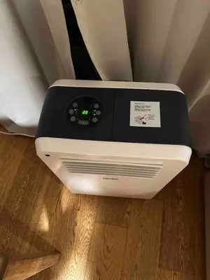a toaster oven sitting on top of a wooden floor at Beautiful 2 bedroom apartment in Place Flagey bxl in Brussels