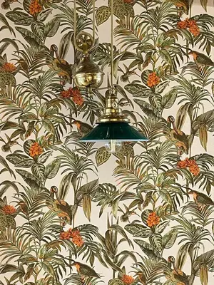 a chandelier hanging from a wall with a floral wallpaper at La Petite Foret Art Deco Apartment in Brussels in Brussels