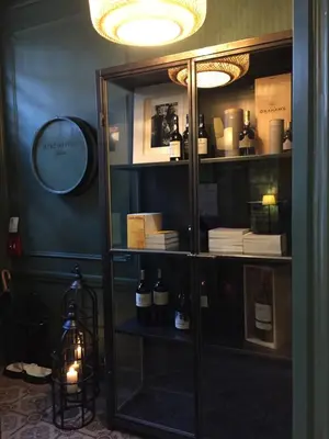 a room with a shelf with bottles of wine at Restaurant & Guesthouse Cachet de Cire in Turnhout
