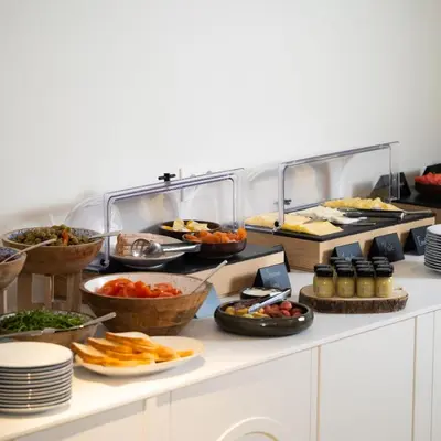 a buffet line with many different types of food at The Liman Hotel in Brussels