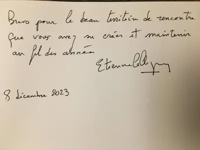 a piece of handwriting on the side of a white refrigerator at B&B Woluwé in Brussels