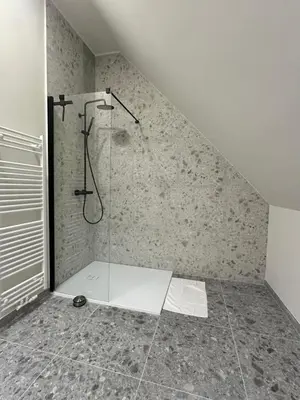 a bathroom with a shower in a attic at Ghent Penthouse in Ghent