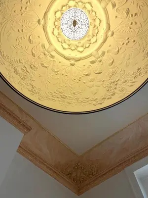 a ceiling with a gold painted ceiling at Jardin du Béguinage - Peaceful Luxury Home in Brussels in Brussels