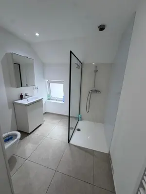 a white bathroom with a shower and a toilet at House 5 minutes walk to Tomorrowland in Boom