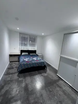 a bedroom with a bed in the middle of it at House 5 minutes walk to Tomorrowland in Boom