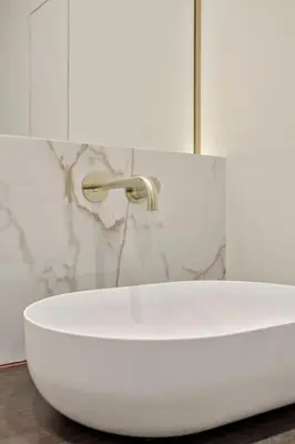 a white bath tub with a faucet in a bathroom at Deluxe 2-BR Apartment in Antwerp in Antwerp