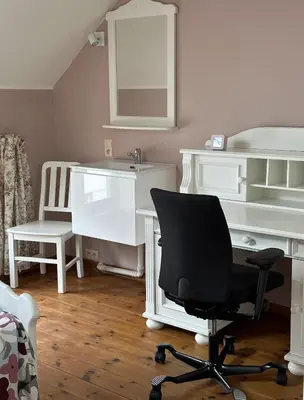 a room with a desk and a chair and a chair at CasaVerde Family House With Duplex Suite in Ghent
