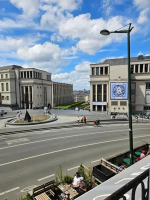 an empty street in a city with buildings at Centre de Bruxelles Merveilleux ! in Brussels