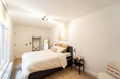 a bedroom with a large bed in a room at Your Antwerp Adventure Sleeps 4 in Antwerp