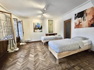 a bedroom with two beds in a room at Résidence Marianne in Brussels