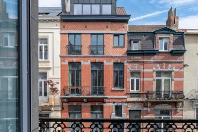 a view of a brick building from a window at Brussels Flagey Elegant in Brussels