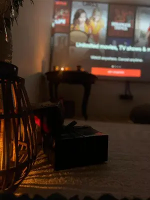 a box sitting on the floor in front of a tv at Magical double bedroom duplex in Brussels