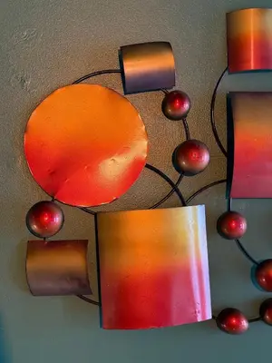 a group of lights with ornaments on a wall at RR Suite in Antwerp