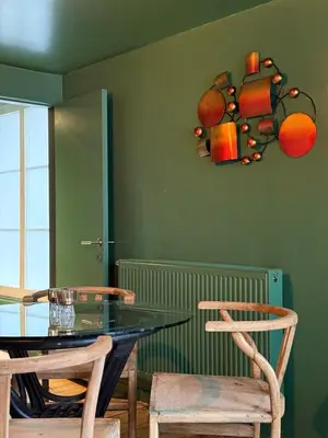 a dining room with a glass table and two chairs at RR Suite in Antwerp
