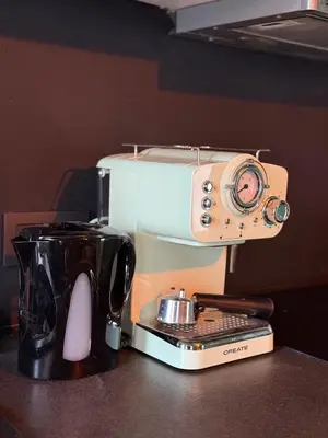 a coffee maker with a camera on top of it at RR Suite in Antwerp