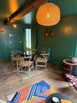 a dining room with a table and chairs at RR Suite in Antwerp