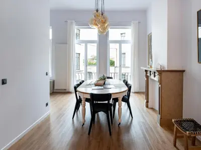 a kitchen and dining room with a table and chairs at Brussels Toison D'or residence in Brussels