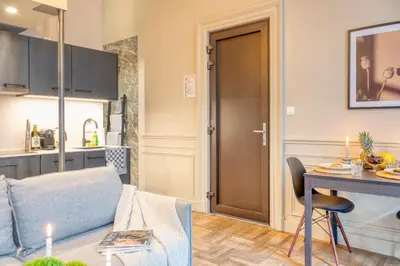 a living room with a couch and a table at Historic Ghent Building - Ideal Studio Retreat in Ghent