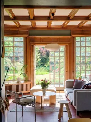 a living room with a couch and a table at Art-deco woning Gent in Ghent