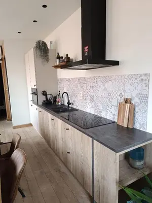 a kitchen with a sink and a counter top at Het Horzelend, oase van rust in een fietsparadijs in Retie