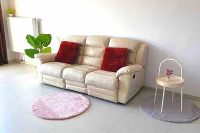 a living room with a couch and a table at Close to central station antwerp in Antwerp
