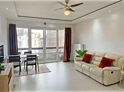 a living room with a couch and a table at Close to central station antwerp in Antwerp